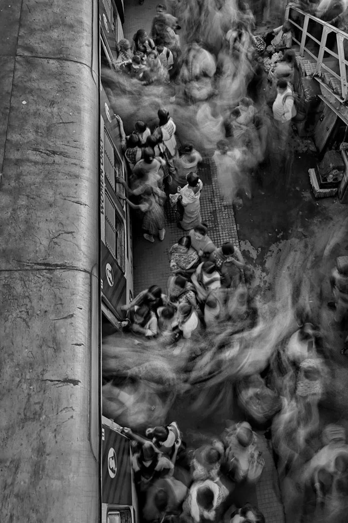 Crowd gathered in a public space, black and white