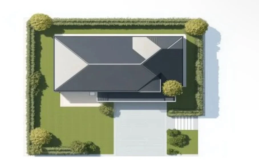 Top-down view of a house with a dark gray roof, surrounded by a green yard and trimmed bushes, with a driveway leading to the front entrance.
