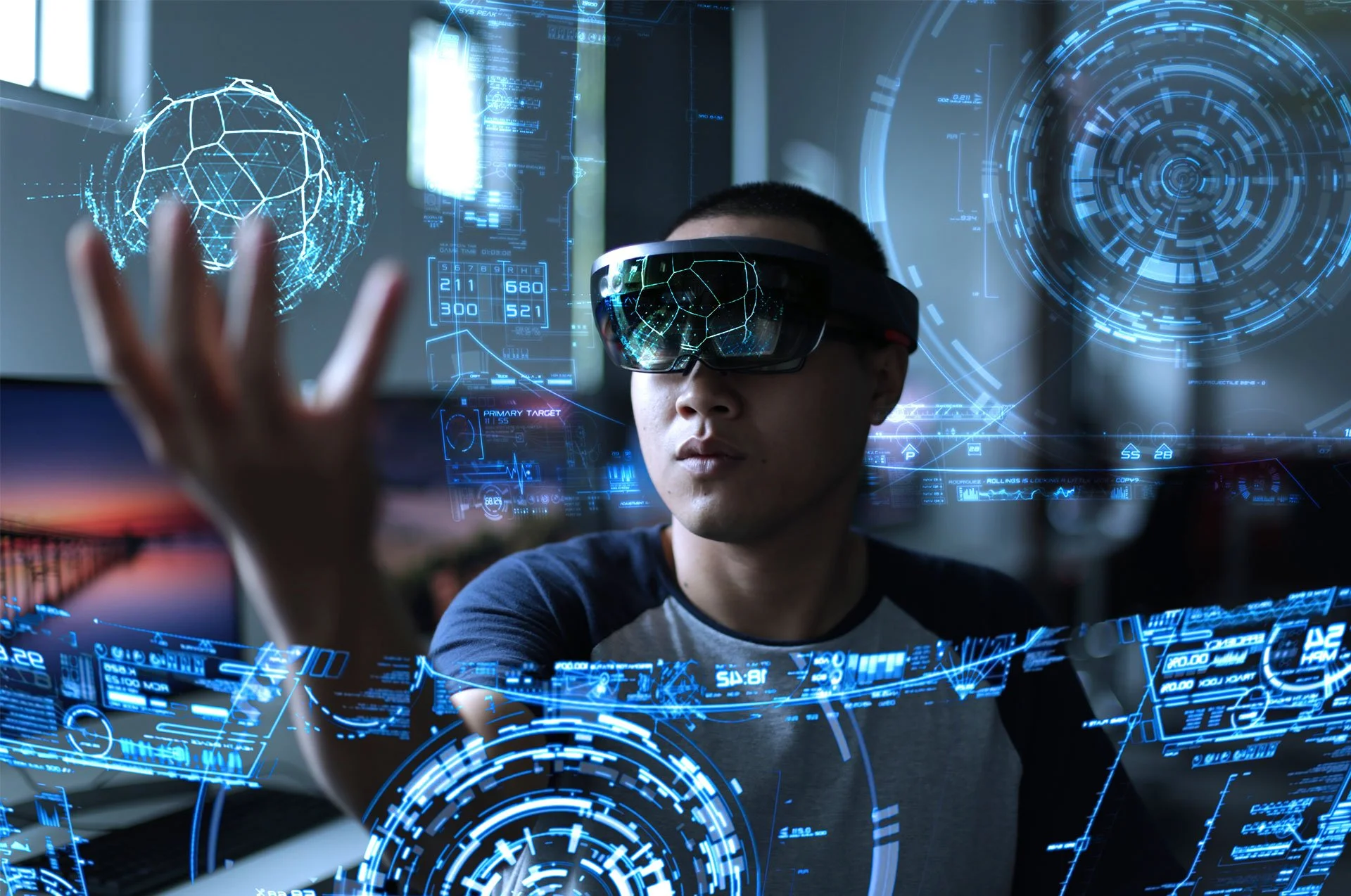 A person wearing a virtual reality headset interacting with holographic digital interfaces. The holograms display futuristic, high-tech graphics and data visualizations.