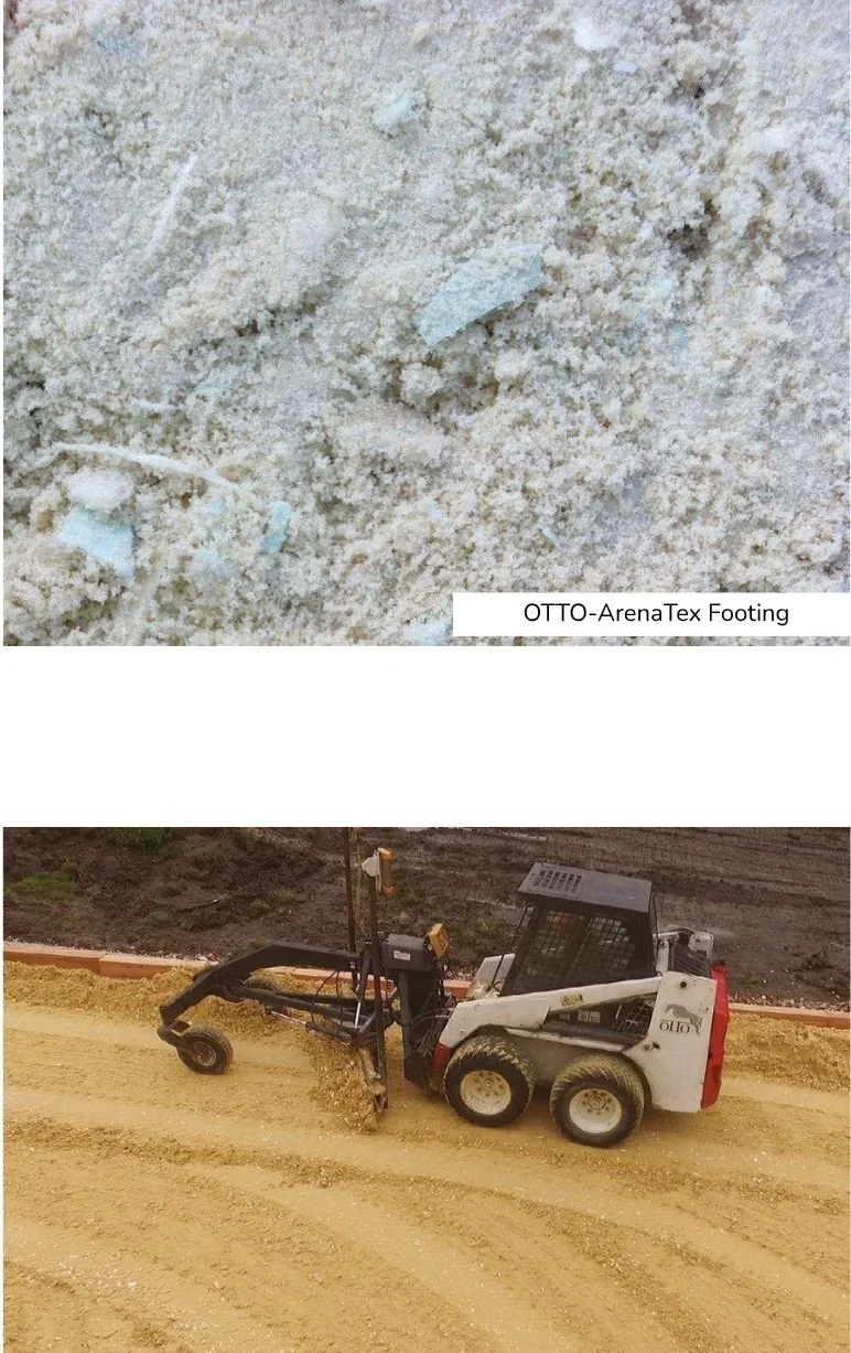 Close-up of light-colored dirt or sand with small rocks and footprints. Construction equipment, a skid-steer loader, is on a dirt road next to a landscaped area with a low brick border.