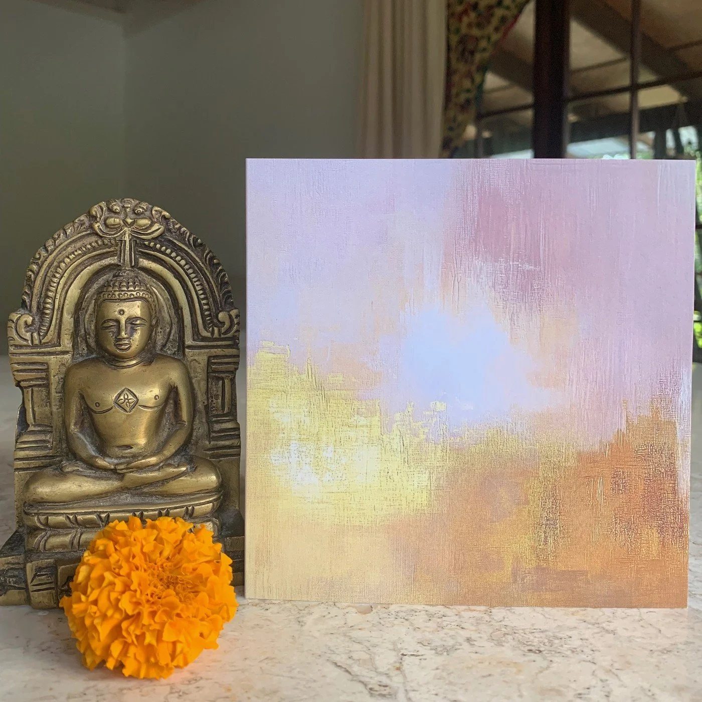 Usha sacred art card, Sacred Dawn, with brass Buddha and marigold.