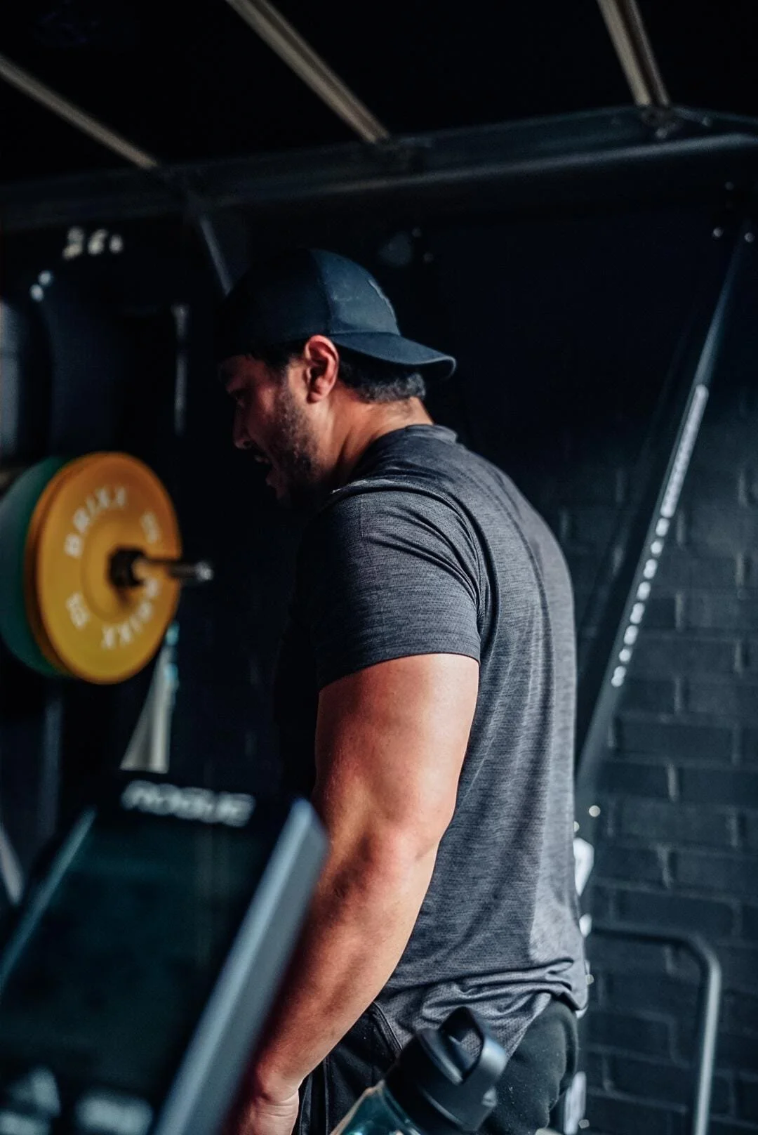 Elite Athletic member lifting a barbell in Sydenham during a coached strength and conditioning session focused on technique, strength and progressive training.