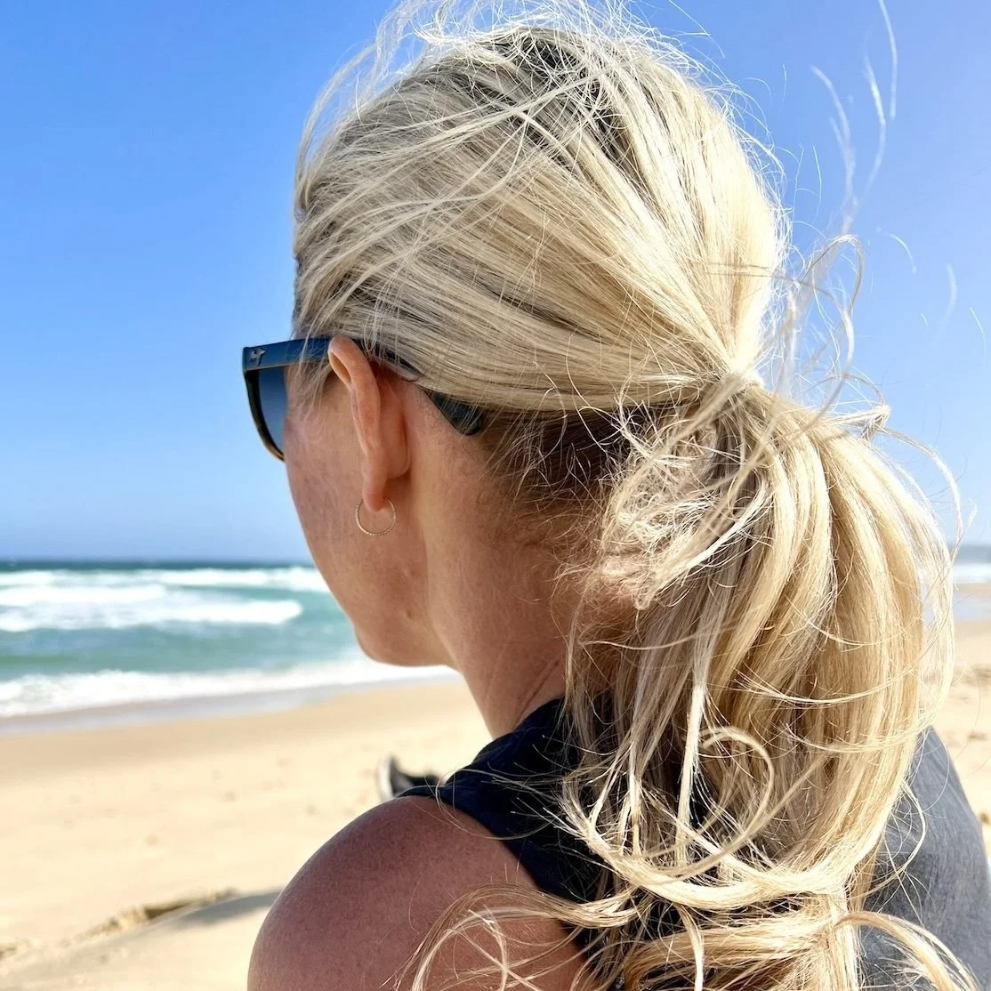 Amanda Adams, artist and founder of Salt Brush Coastal, over looking the beach in Newcastle, NSW.