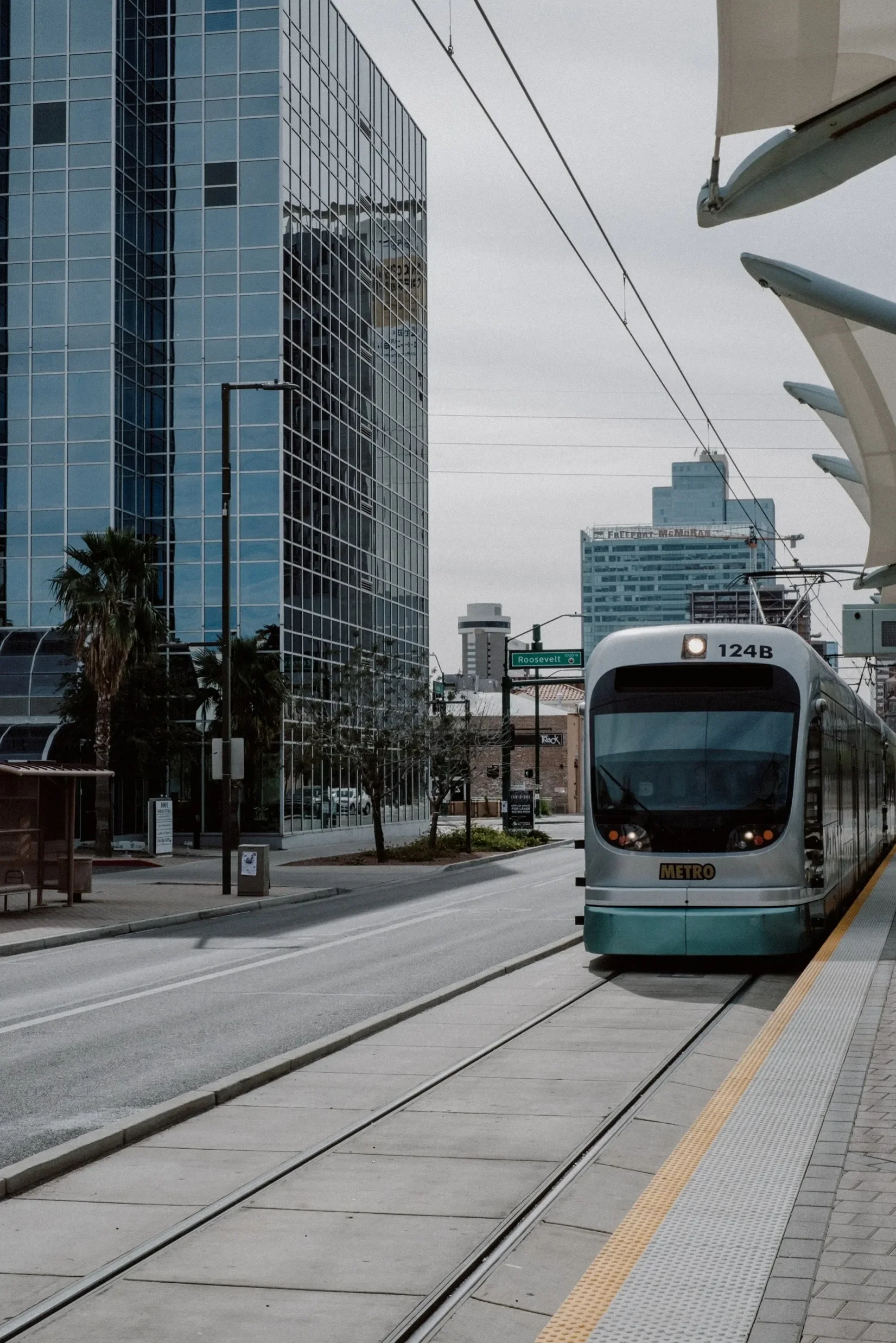 Light rail train at a station, regenerative braking energy captured by a wayside flywheel