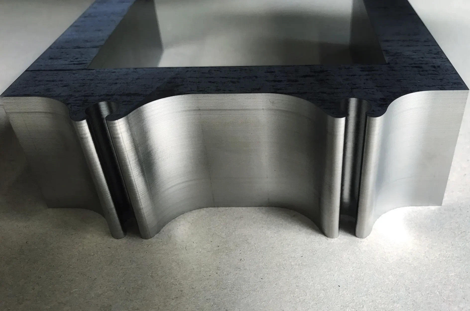 Curved stator and magnetic bearing assembly of the Teraloop hubless flywheel, part of the passive and active magnetic levitation system.