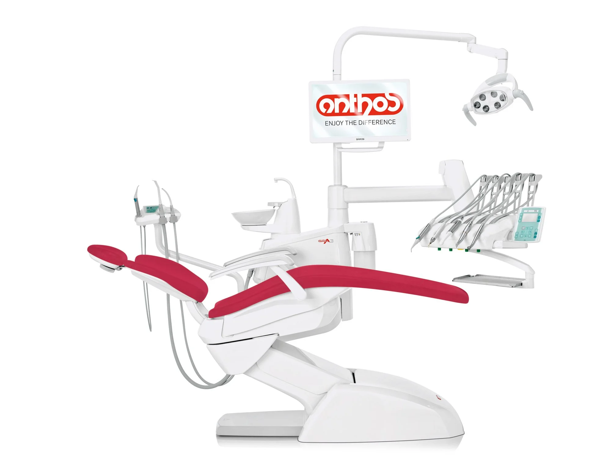Modern dental chair with attached equipment including a monitor displaying the word 'anthea' and slogan 'Enjoy the difference', dental tools, and overhead light, all in white and red accents.