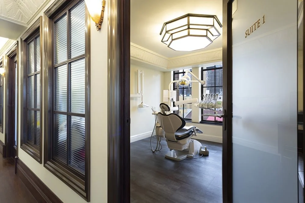 Dental office with chair and equipment, labeled Suite 1
