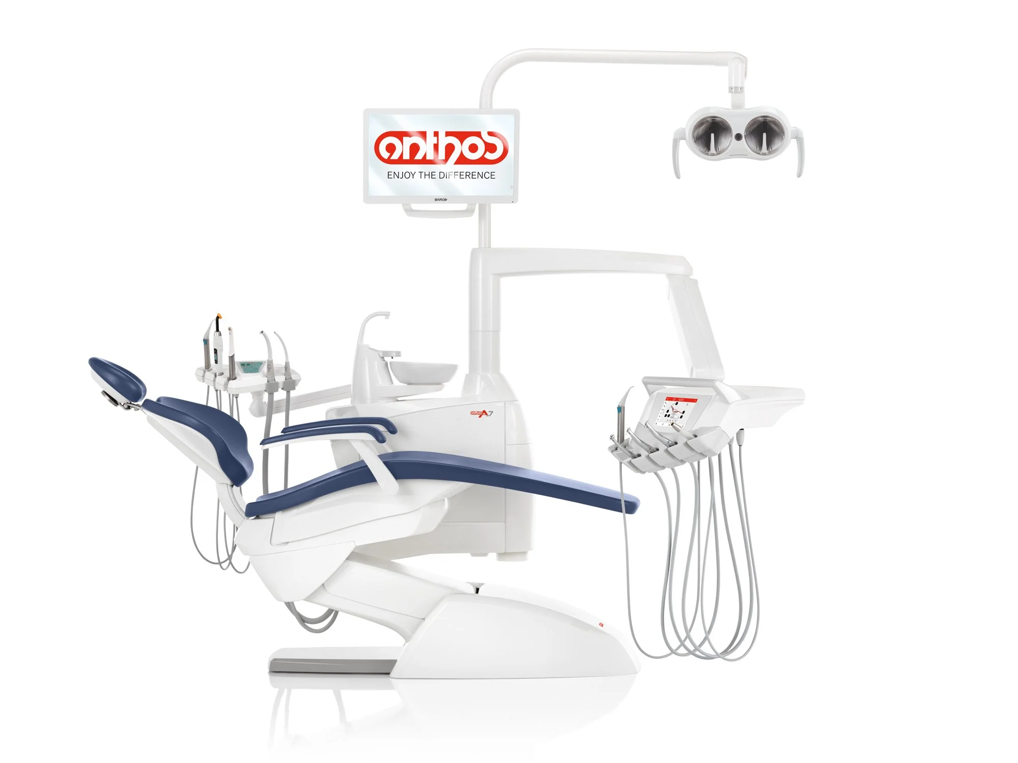 Modern dental examination chair with various attached dental tools and a screen displaying the word 'Caring' in reverse.