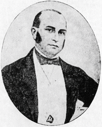 Black and white portrait of James de Alwis in formal attire, wearing a bow tie and jacket, with a serious expression.