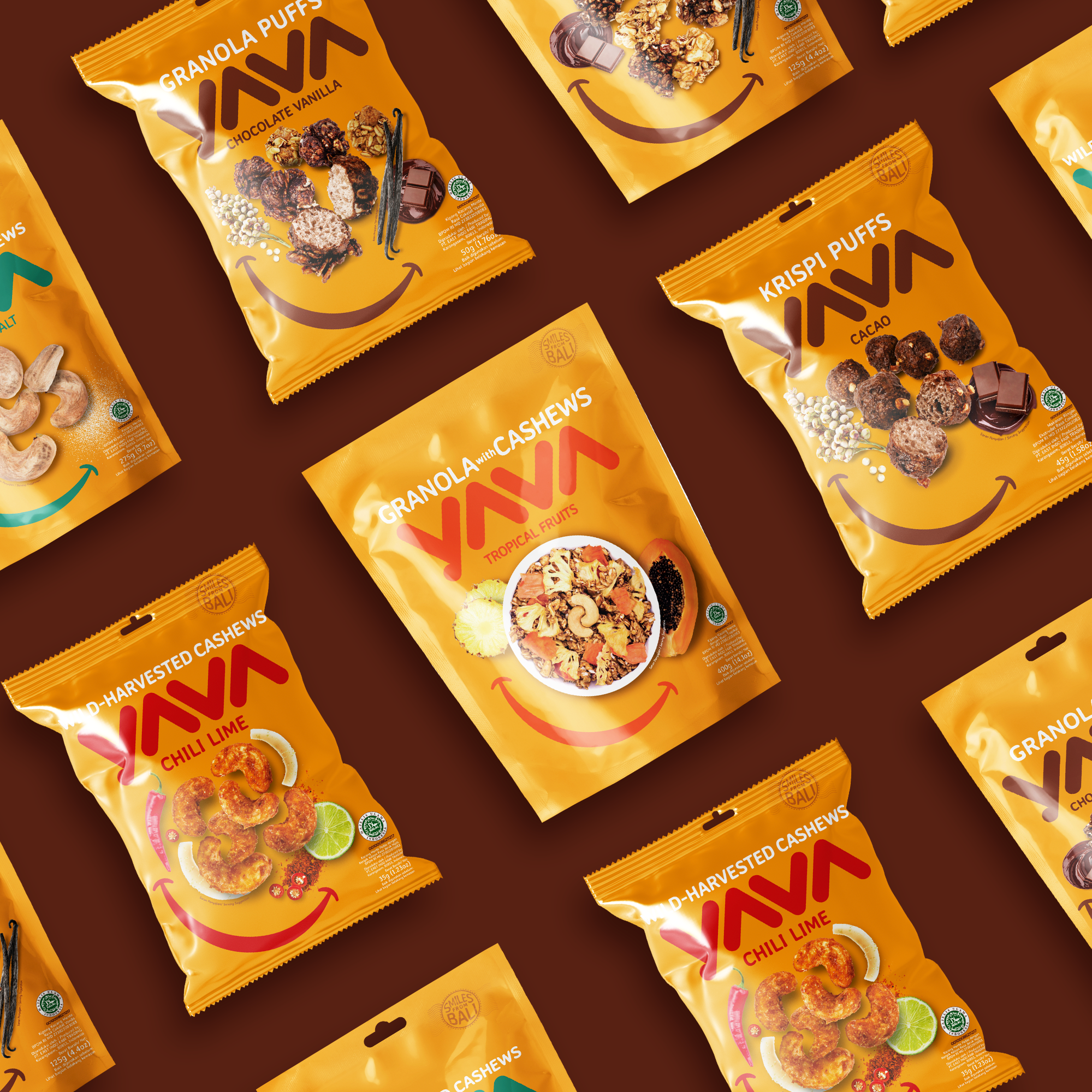 Multiple yellow snack bags with different flavors of AVA brand snacks, displaying images of crunchy nuts, chocolate, and spices on their packaging, arranged on a dark brown background.