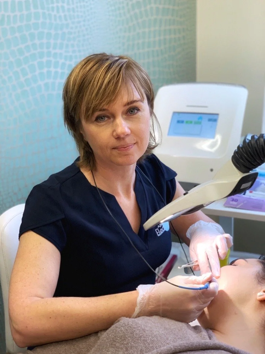 Dentist performing a dental procedure on a patient in a clinical setting.
