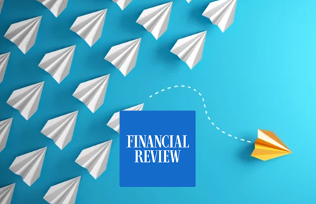 Multiple white paper airplanes flying towards a yellow paper airplane, with a blue square labeled 'Financial Review' in the foreground.