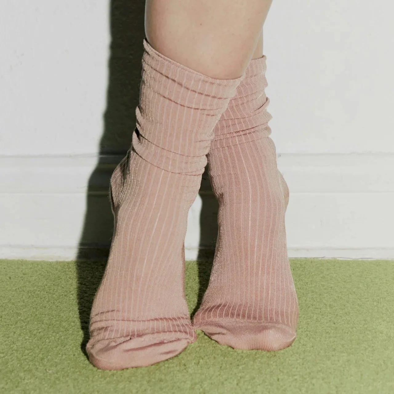 Pink socks on tip-toes