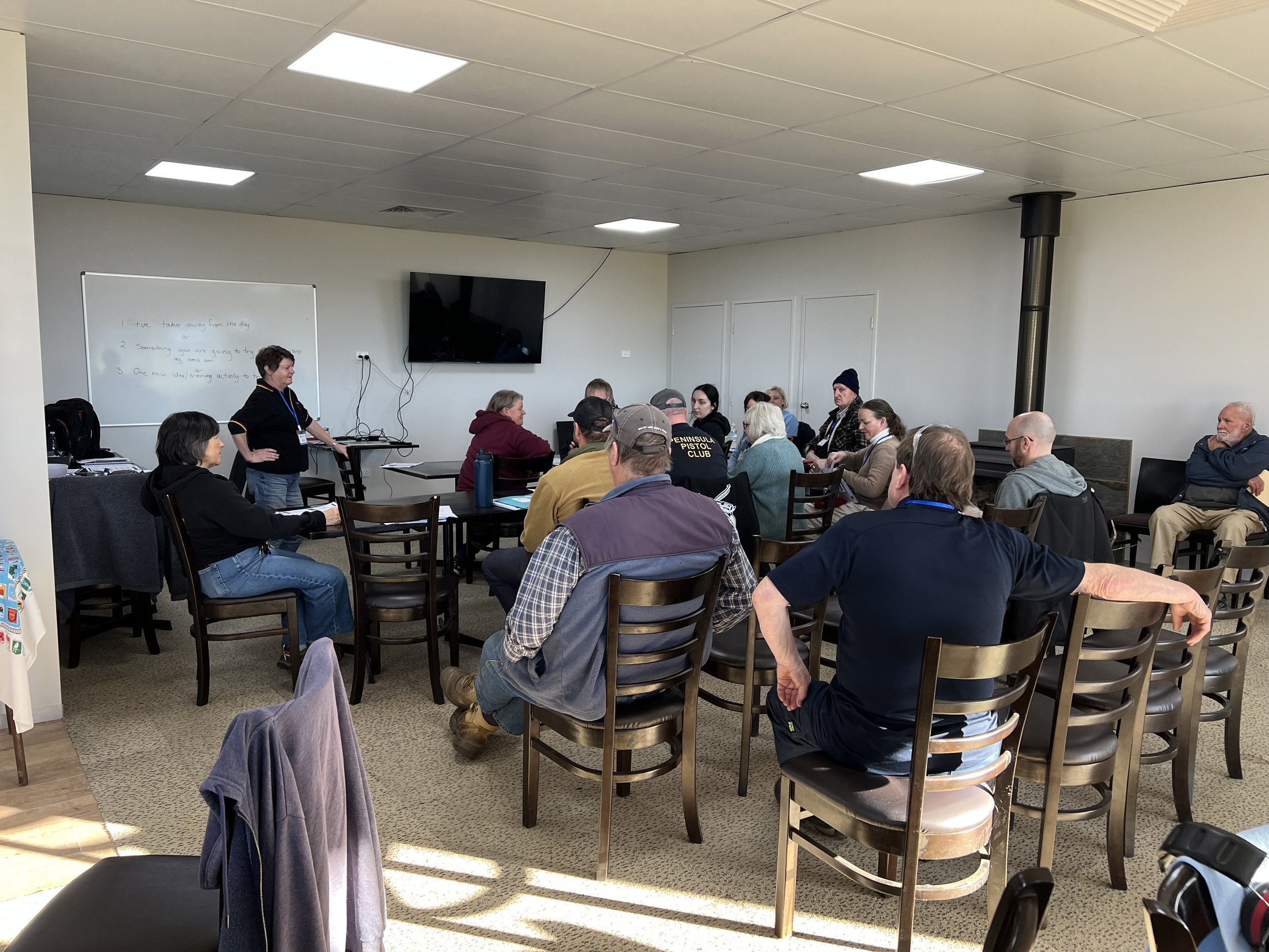 Athletes engaged in the lecture segment at the Yackandandah Pistol Club Coaching Clinic.