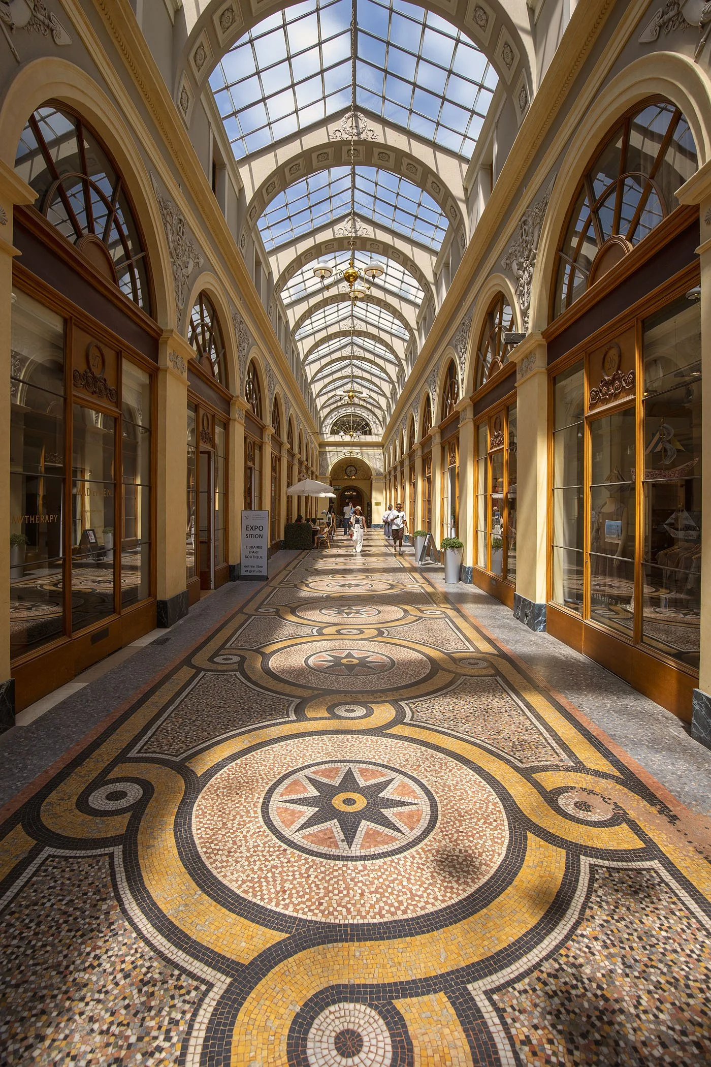 Parisian glass-roofed arcade with mosaic tile floor, fine art architecture photography print by Hermès Gray, limited edition