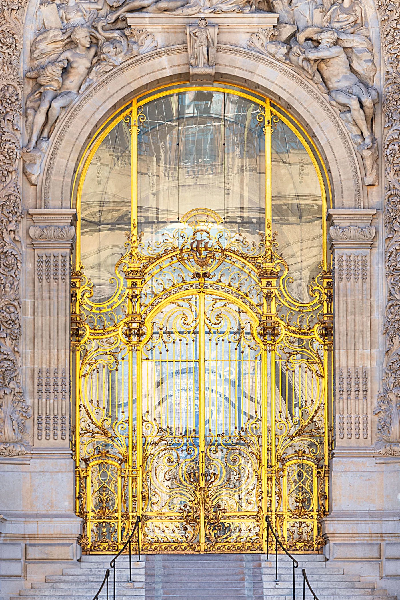 Ornate golden gate within a stone archway in Paris, fine art architecture photography print by Hermès Gray, limited edition