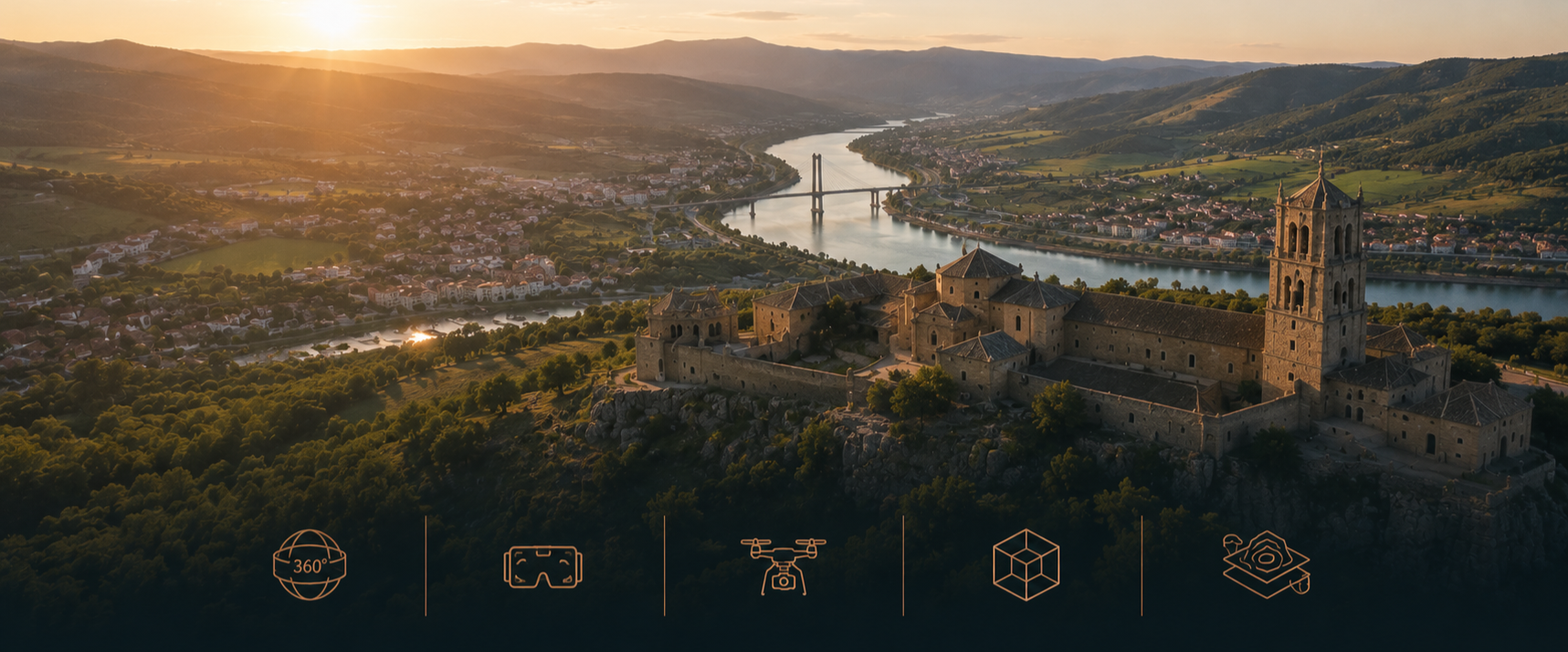 Vista aérea de un castillo medieval en una colina, con un río que pasa cerca y un puente moderno en el fondo, al atardecer con el sol bajando por el horizonte.