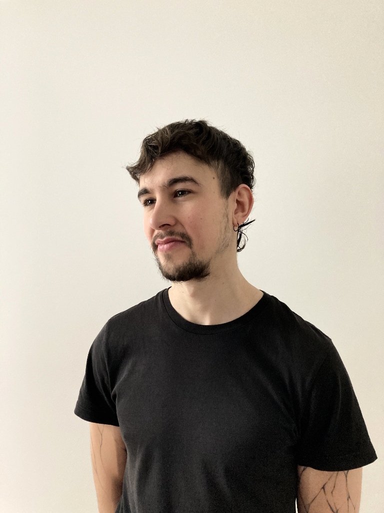 young man with beard and black shirt