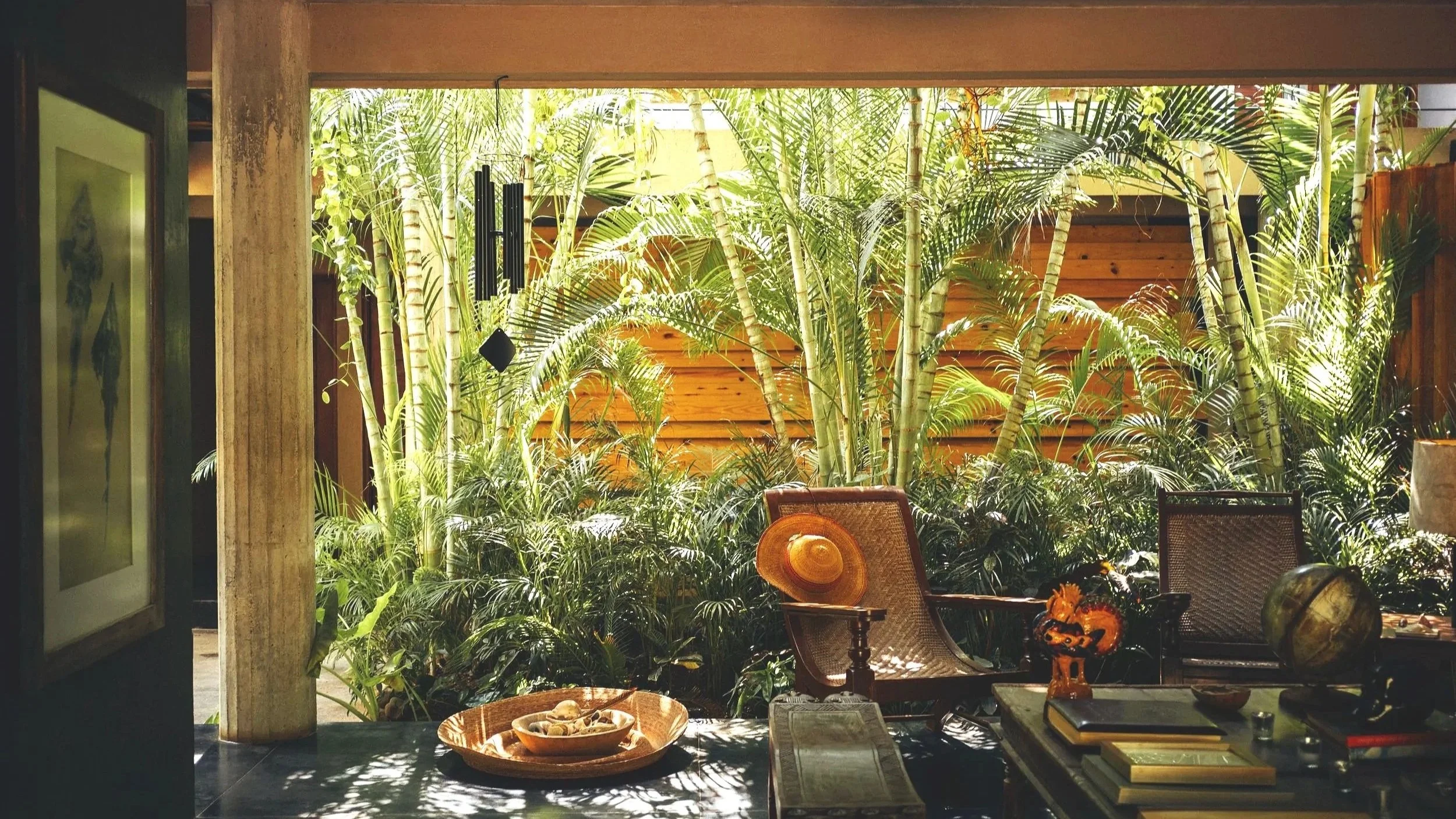 lo sereno lobby with flowers and hat on chair