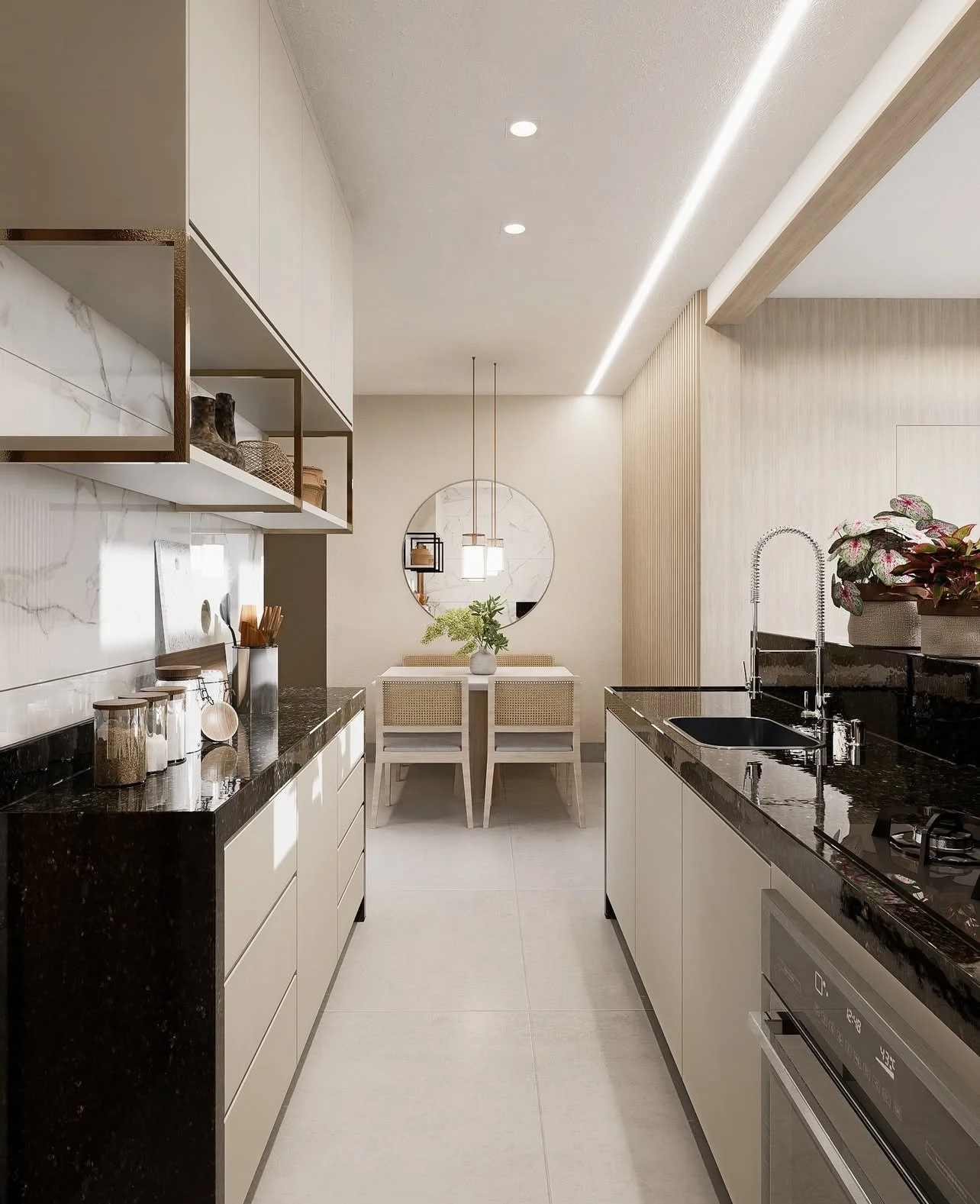 Modern kitchen with black countertops, white cabinets, and a dining area with a round mirror and a table with four chairs.