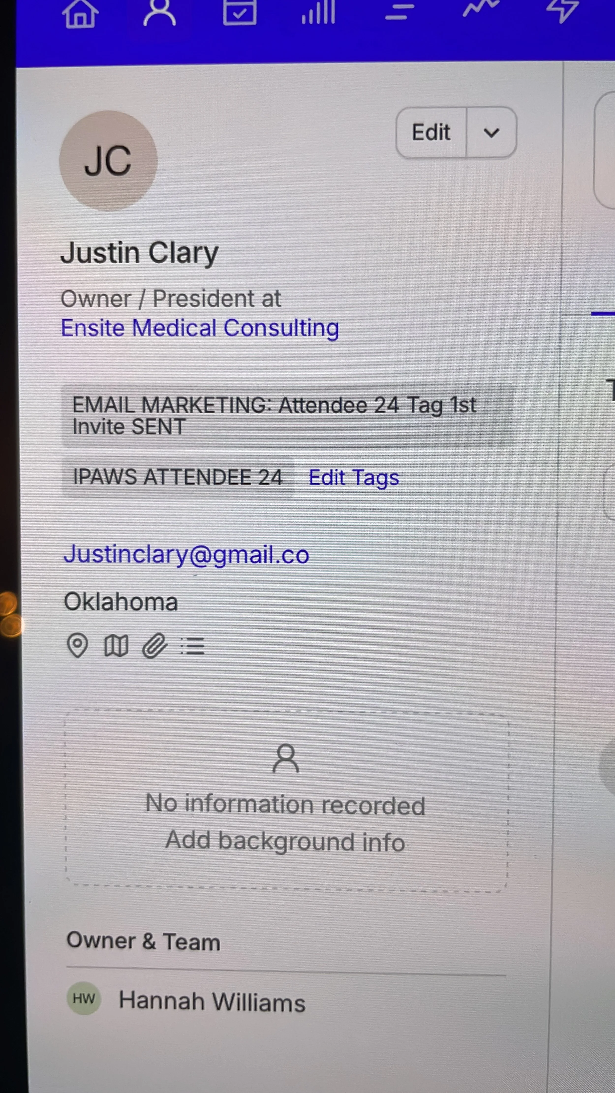 A screenshot of a contact profile for Justin Clary on a digital platform, showing his name, title as owner/president at Ensit Medical Consulting, email address, location in Oklahoma, and team member Hannah Williams.