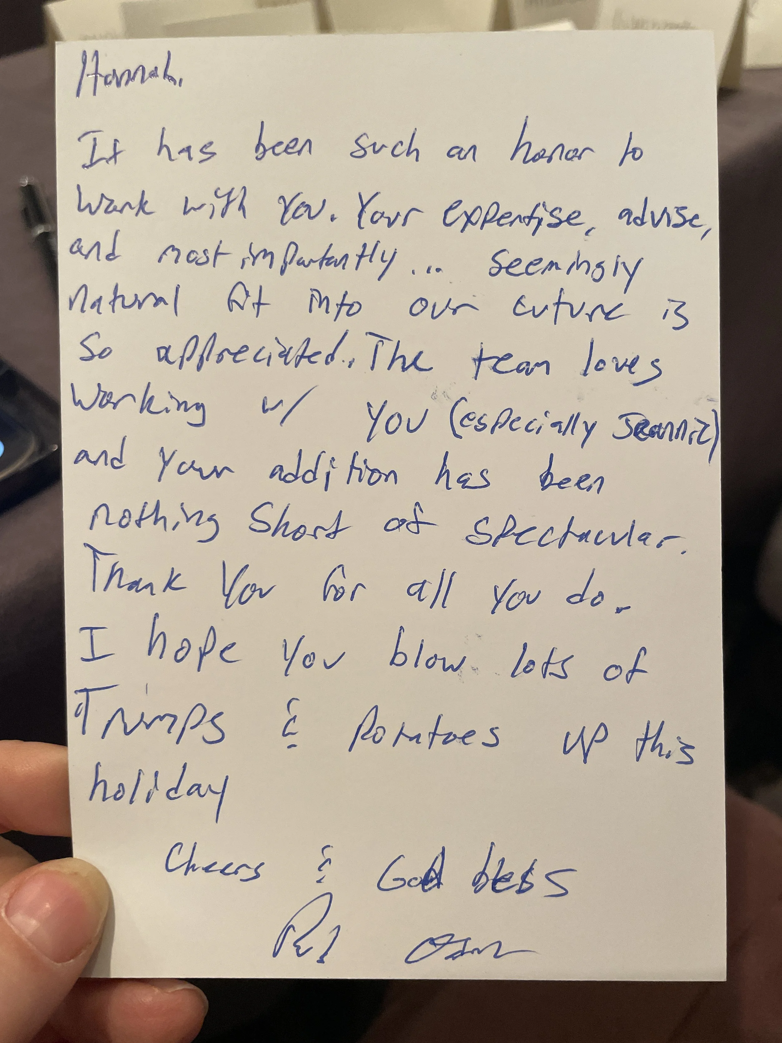 Handwritten thank you note on white paper expressing appreciation for someone's expertise and contributions, wishing them success in the holiday season.