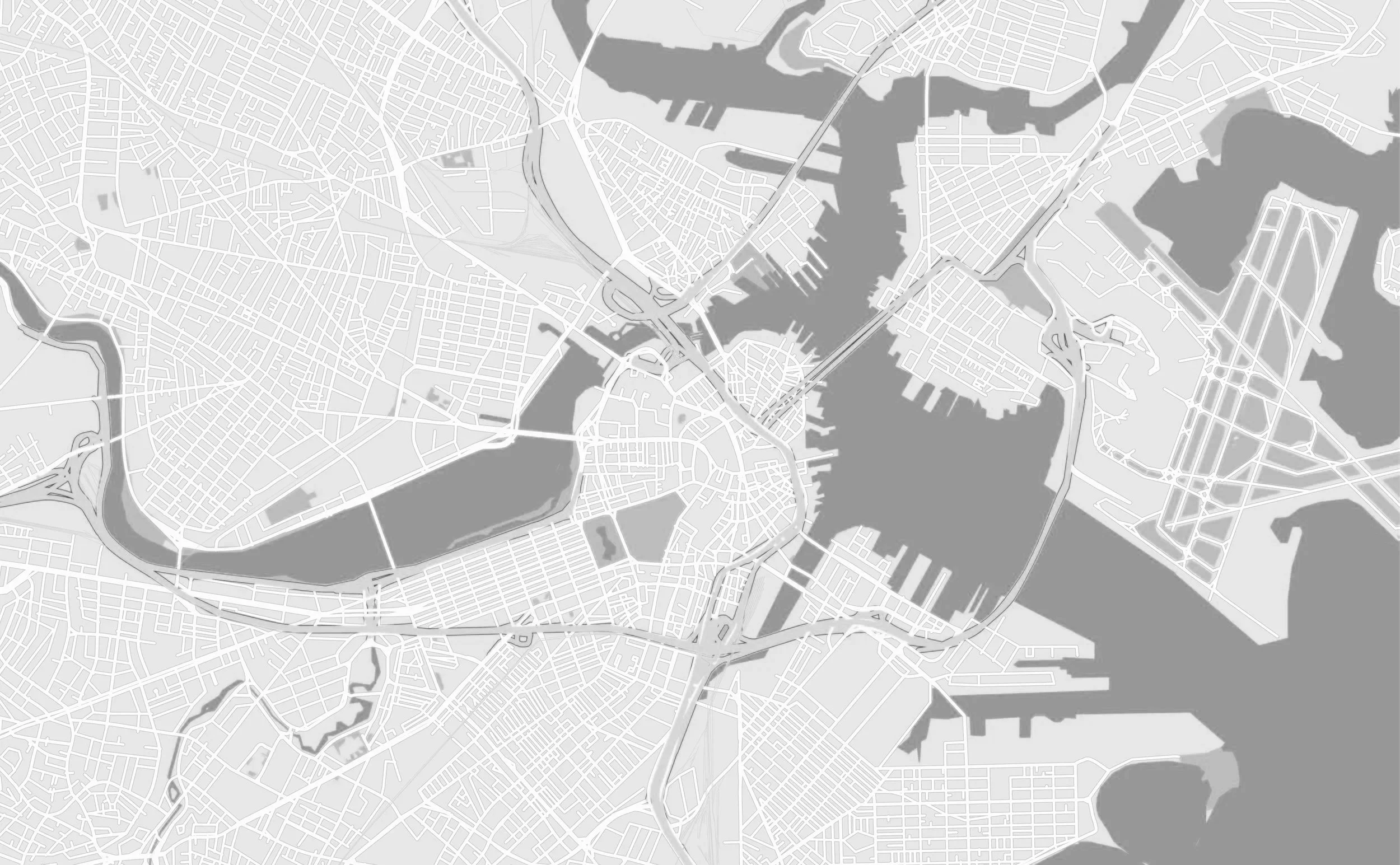 A grayscale map showing a city with waterways, parks, and streets, including bridges crossing the water.