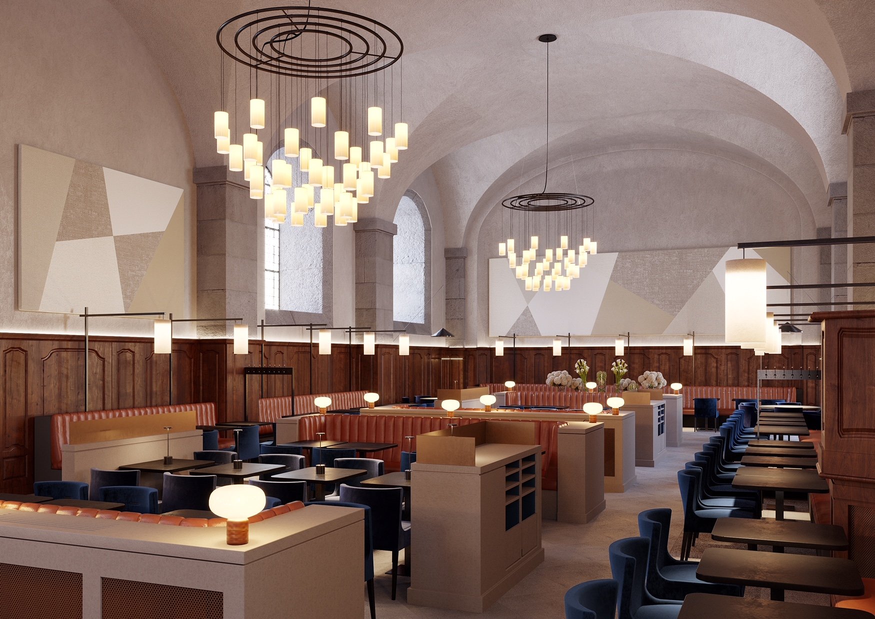 Salle de restaurant avec plafonds voûtés, chandeliers modernes, murs en pierre, tables en bois, et éclairage doux.