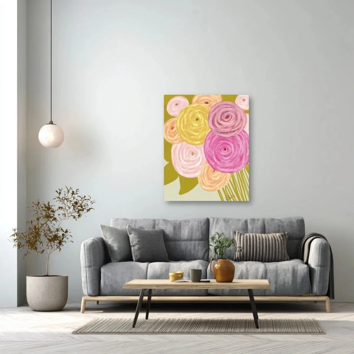 Living room with a gray sofa, a coffee table, a potted plant, a hanging lamp, and a floral painting on the wall.