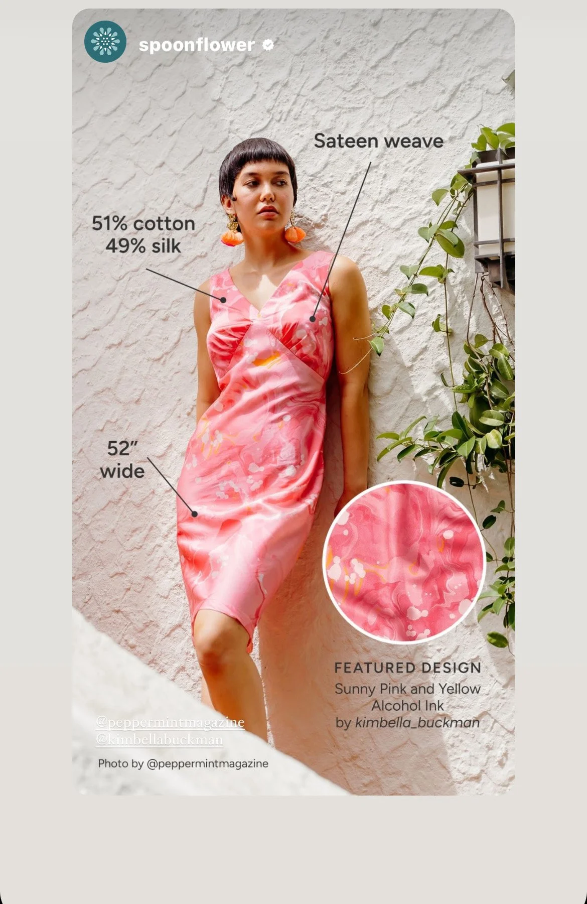 A woman with short dark hair wearing a pink and yellow tie-dye slip dress with floral patterns, standing against a white textured wall with green plants. The dress is 52 inches wide, made of 51% cotton and 49% silk, and features a sateen weave. The image includes annotations about the dress's fabric, size, and a close-up of the fabric pattern, which is Summer Pink and Yellow alcohol ink by Kimbella Buckman. The photo credit goes to peppermintmagazine and Kimbella Buckman.