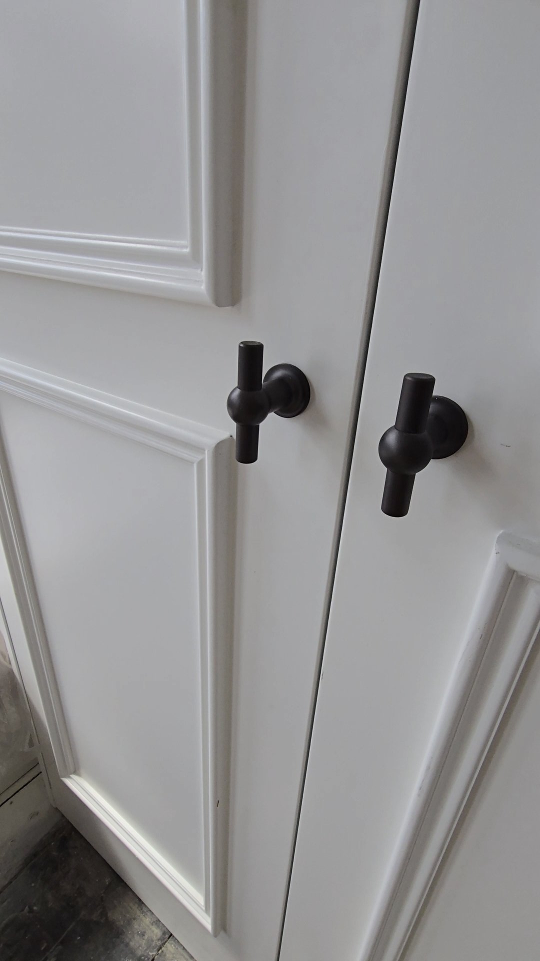 image of luxury handles on custom made wardrobe doors in off white