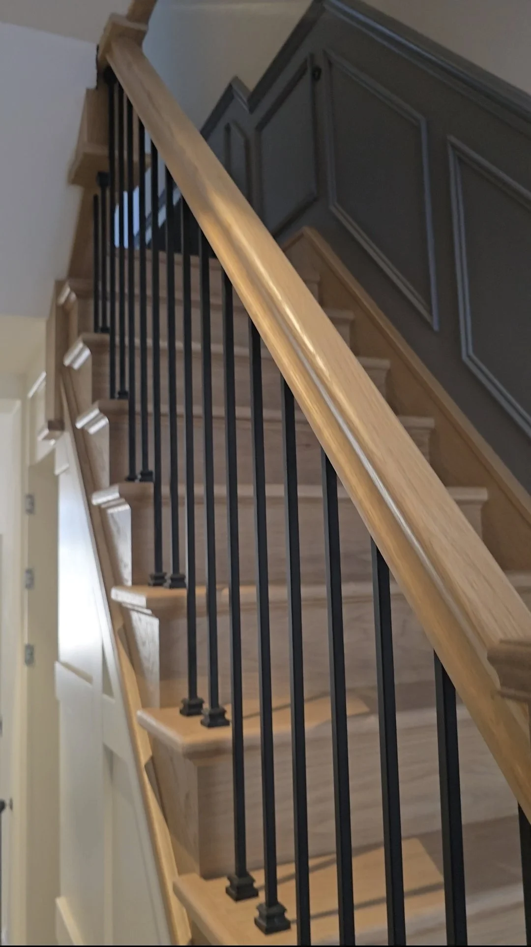 oak staircase with open treads and metal spindles