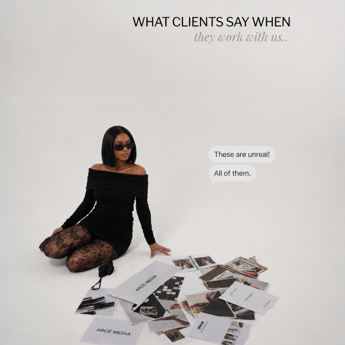 A woman in black off-shoulder dress and patterned tights sitting on the floor amidst scattered photographs, with a white background. Text on the background reads "WHAT CLIENTS SAY WHEN they work with us.." and a speech bubble says "These are unreal! All of them.".