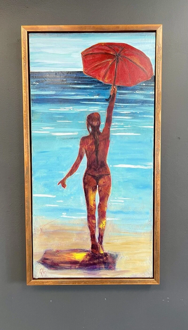 Painting of a woman in bikini holding a red umbrella at the beach, facing the water with shoreline and ocean in the background.