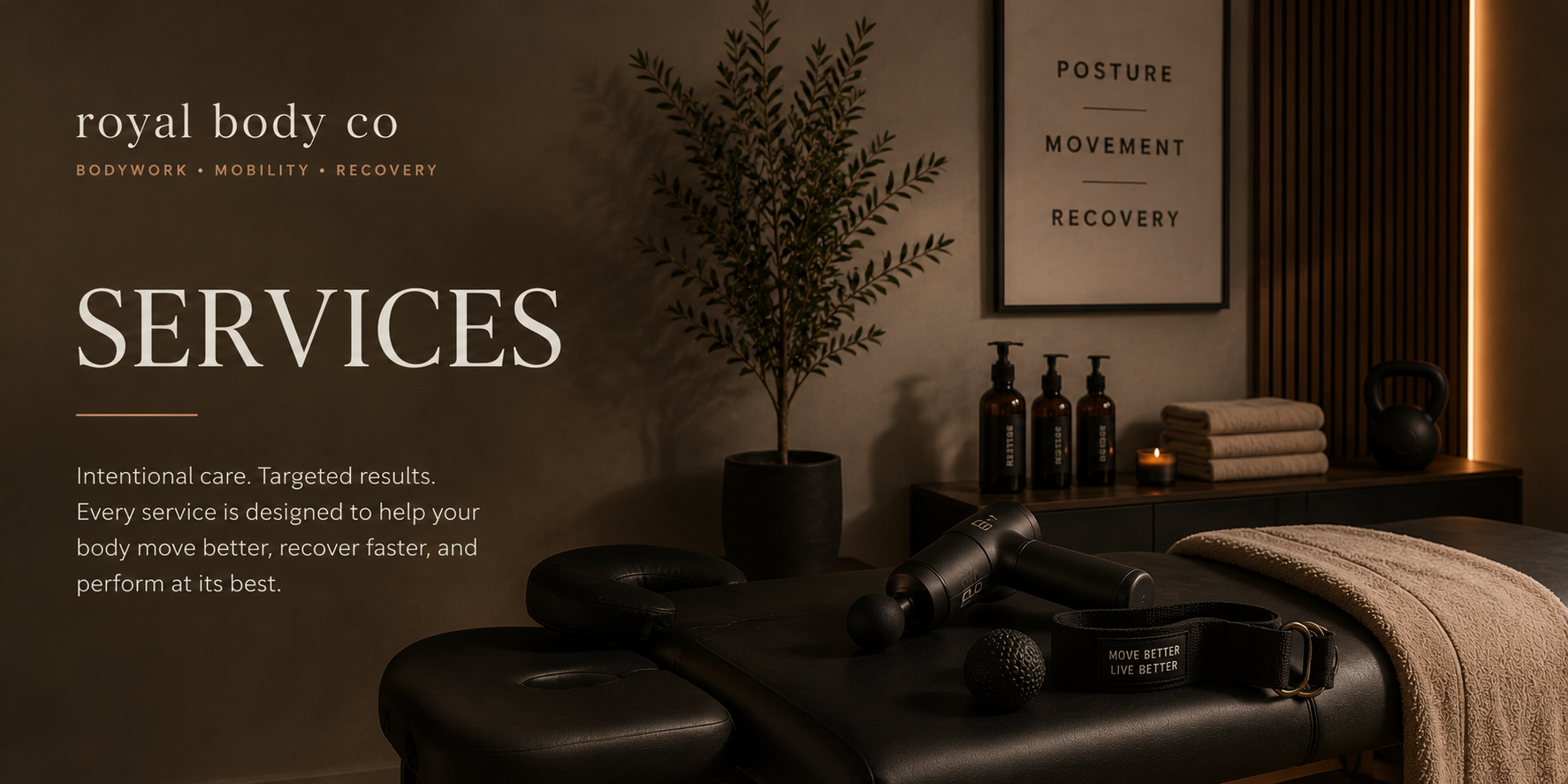 Spa room with massage table, black massage roller, massage ball, headrest, towels, water bottles, candle, and framed motivational poster in the background.