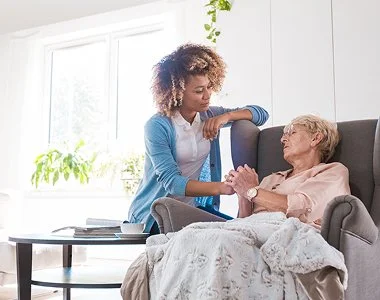 Elderly woman with nurse - residential nursing care in Medford