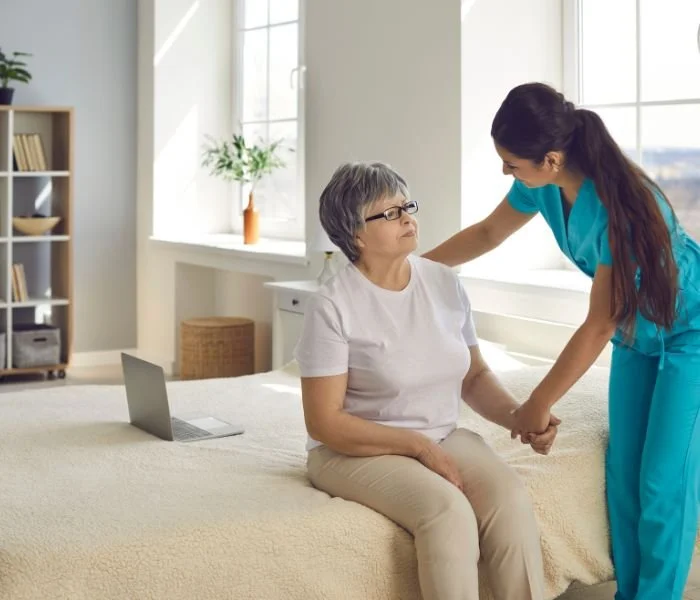 Caregiver providing mobility support for elderly