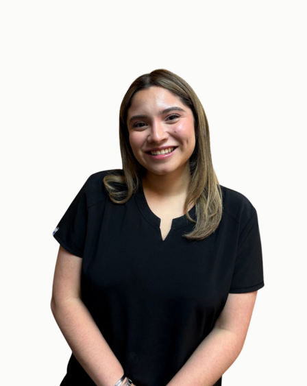 A woman with long brown hair, smiling, wearing a black shirt against a white background.
