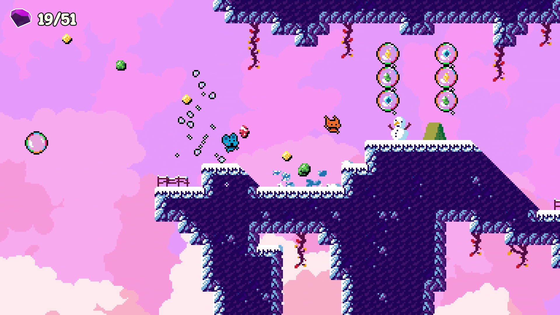 Pixel art video game scene with a pink sky background featuring platforms, ice and purple rocks, with a snowman, a brown cat, colorful bubbles, and various collectible items.