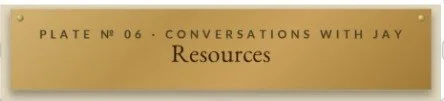 A gold-colored sign with black text that reads 'PLATE No 06 - CONVERSATIONS WITH JAY Resources'.