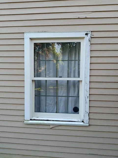 Old broken windows with water rot in Hanover Ontario