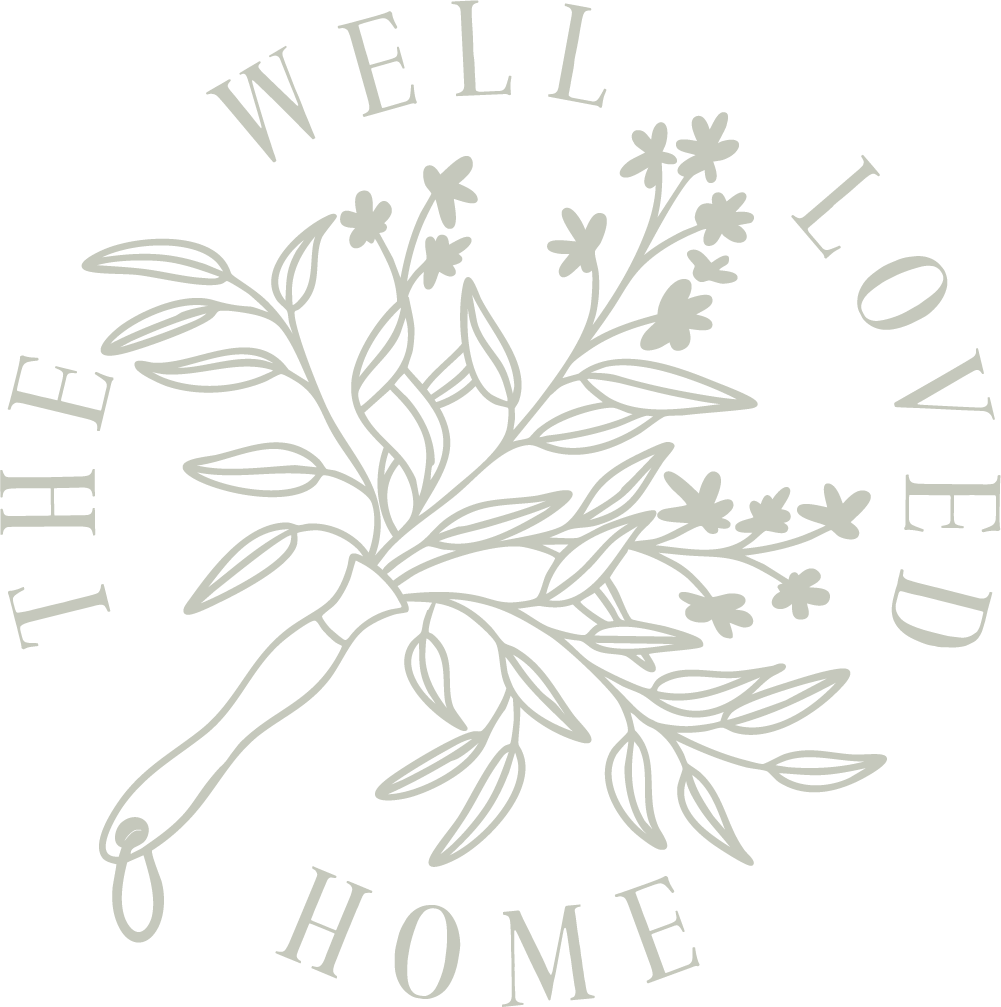 A circular logo design that says " The Well Loved Home"