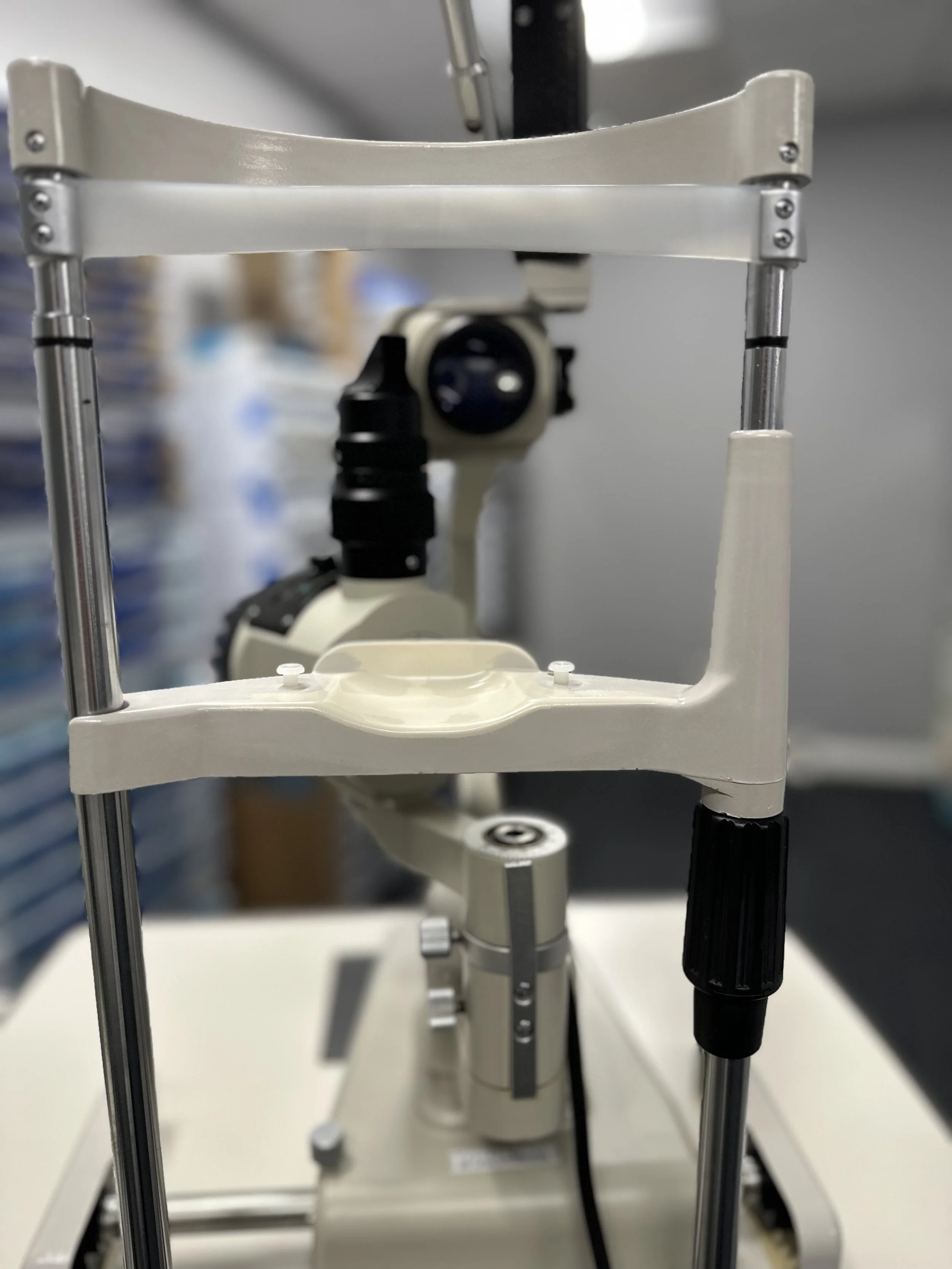 Microscope on a lab bench in a laboratory setting.
