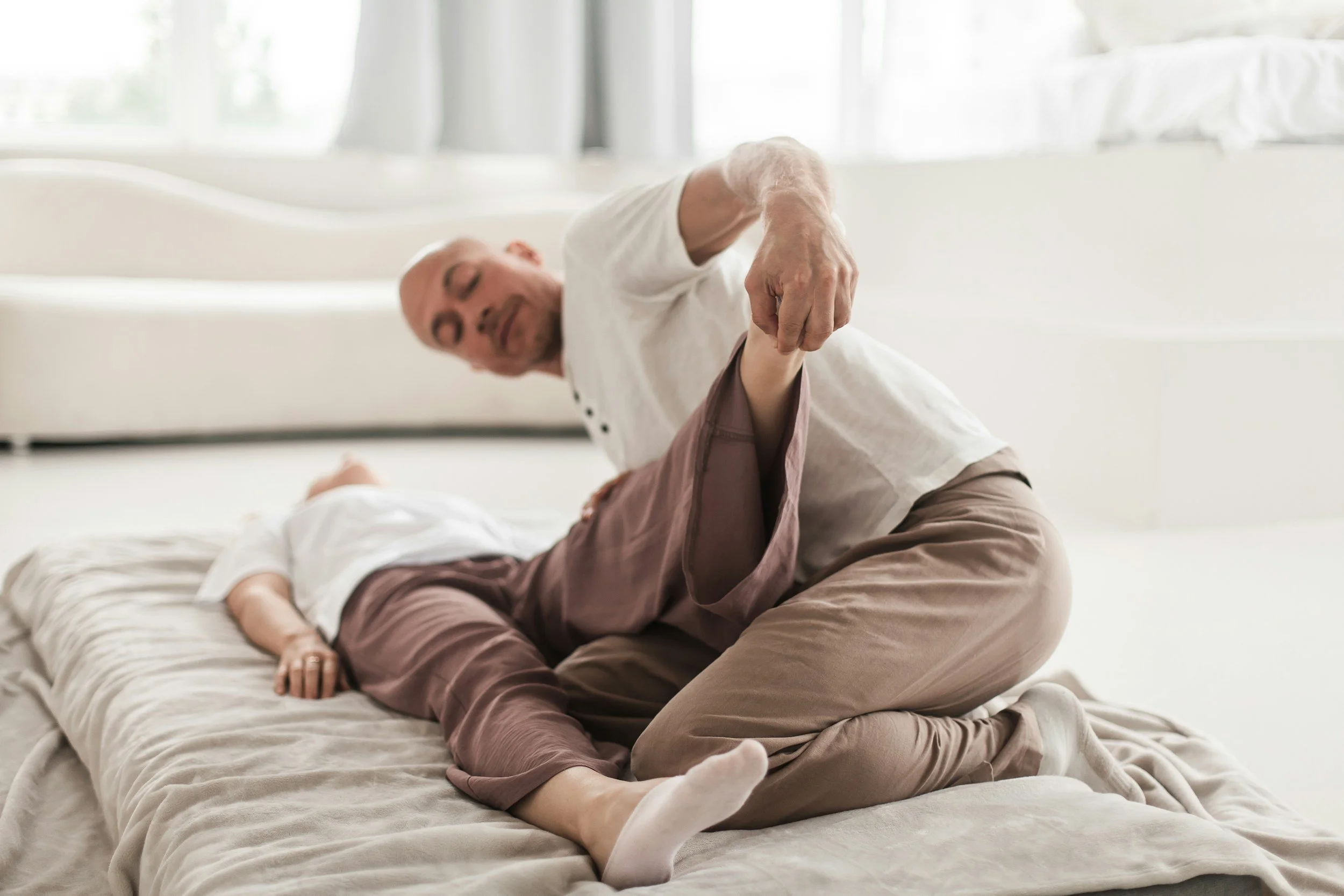 Assisted stretching being performed.