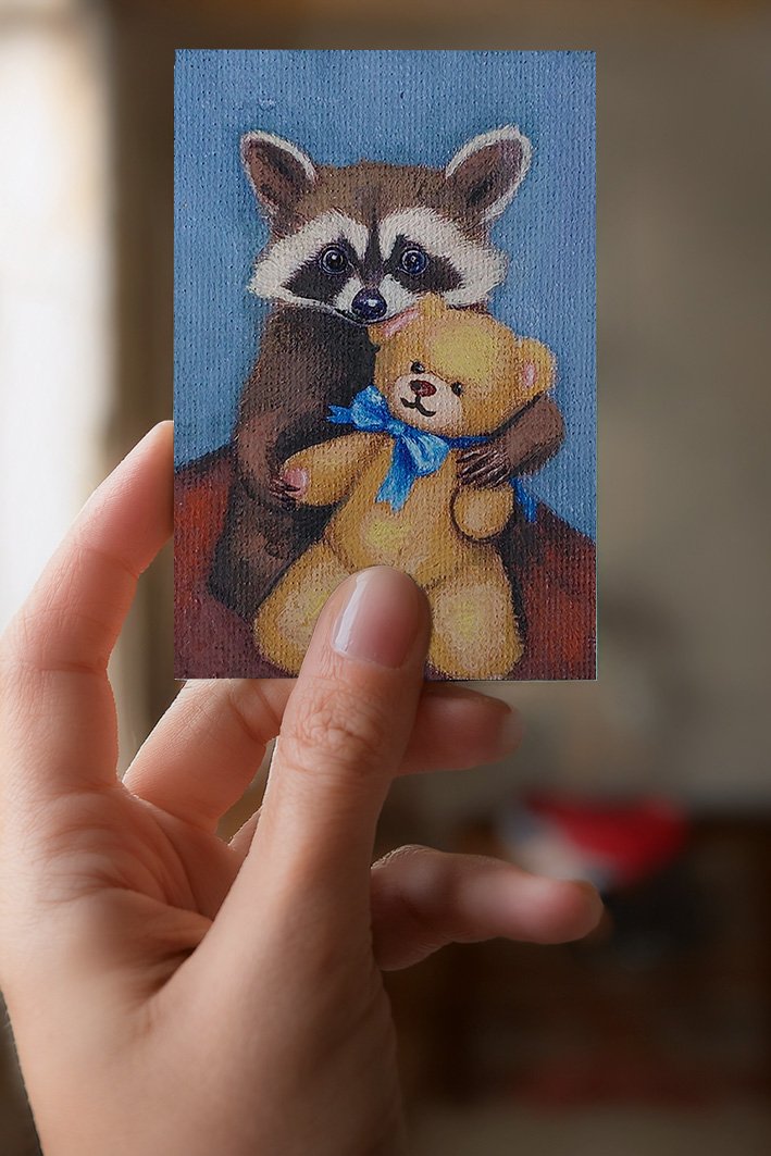 ATL painting of raccon holdin a teddy on a blue background