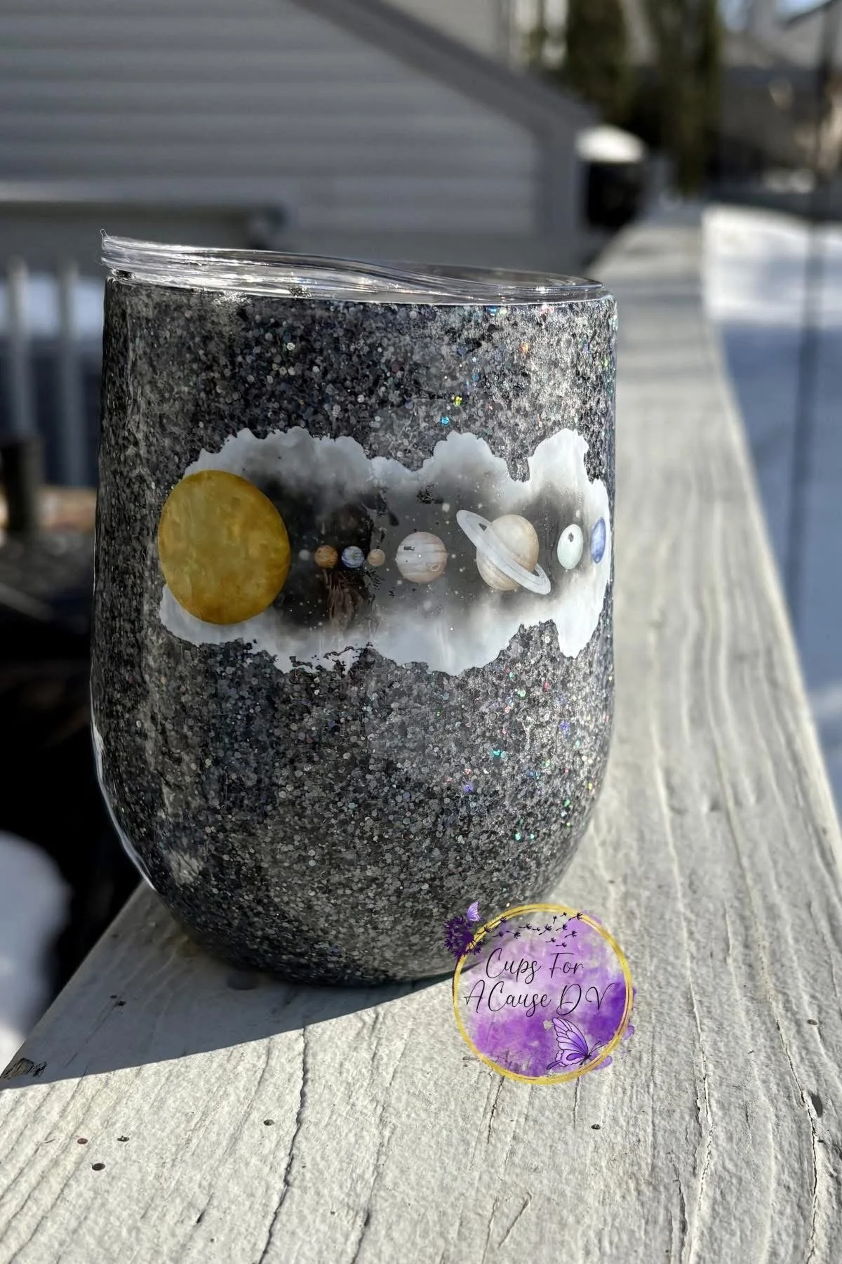 Planets on holographic black glitter