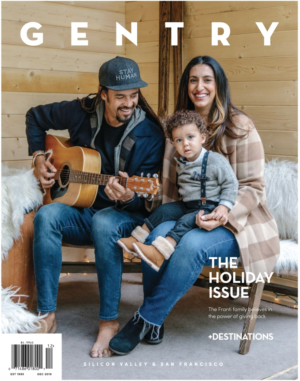 Family sitting on a bench in a wooden cabin, with a man playing acoustic guitar, a woman holding a young child, and large white letters spelling 'GENTRY' above them. Cover text includes 'The Holiday Issue' and mentions Silicon Valley and San Francisco.