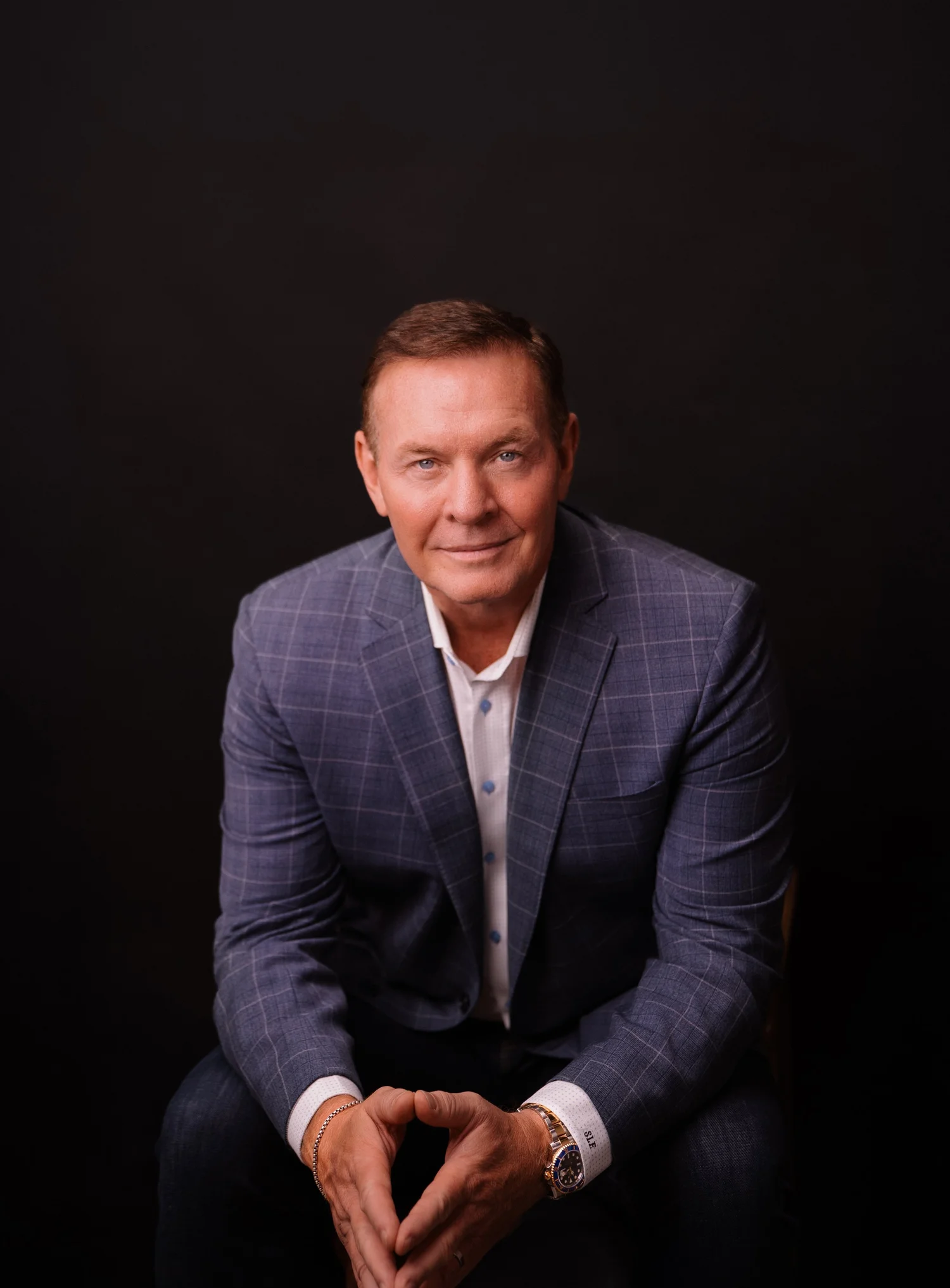 Editorial portrait of a man wearing a suit