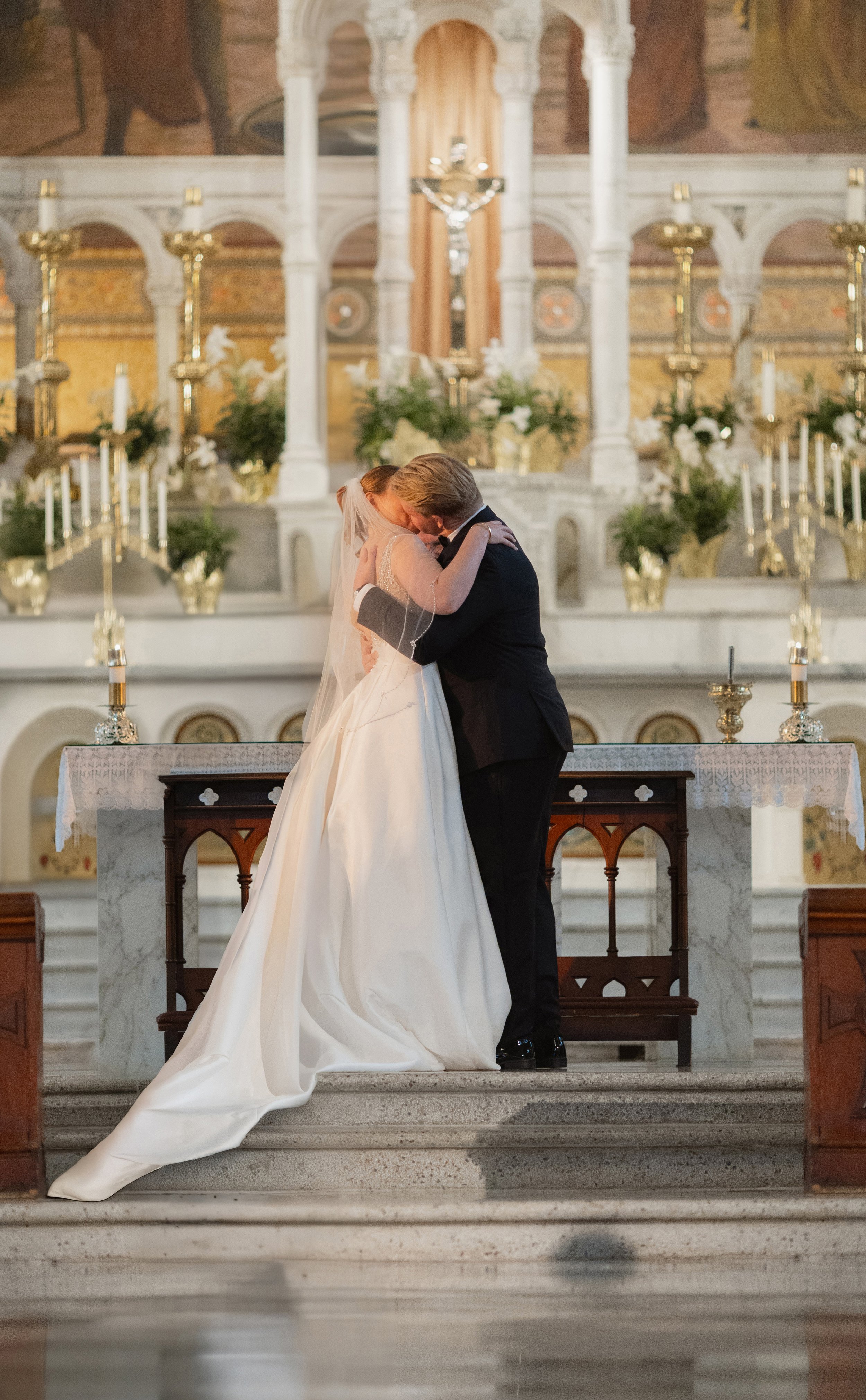 Removed a foreground distraction from this wedding photo in Photoshop to restore the intimacy, symmetry, and emotion of the moment as it was meant to be remembered.