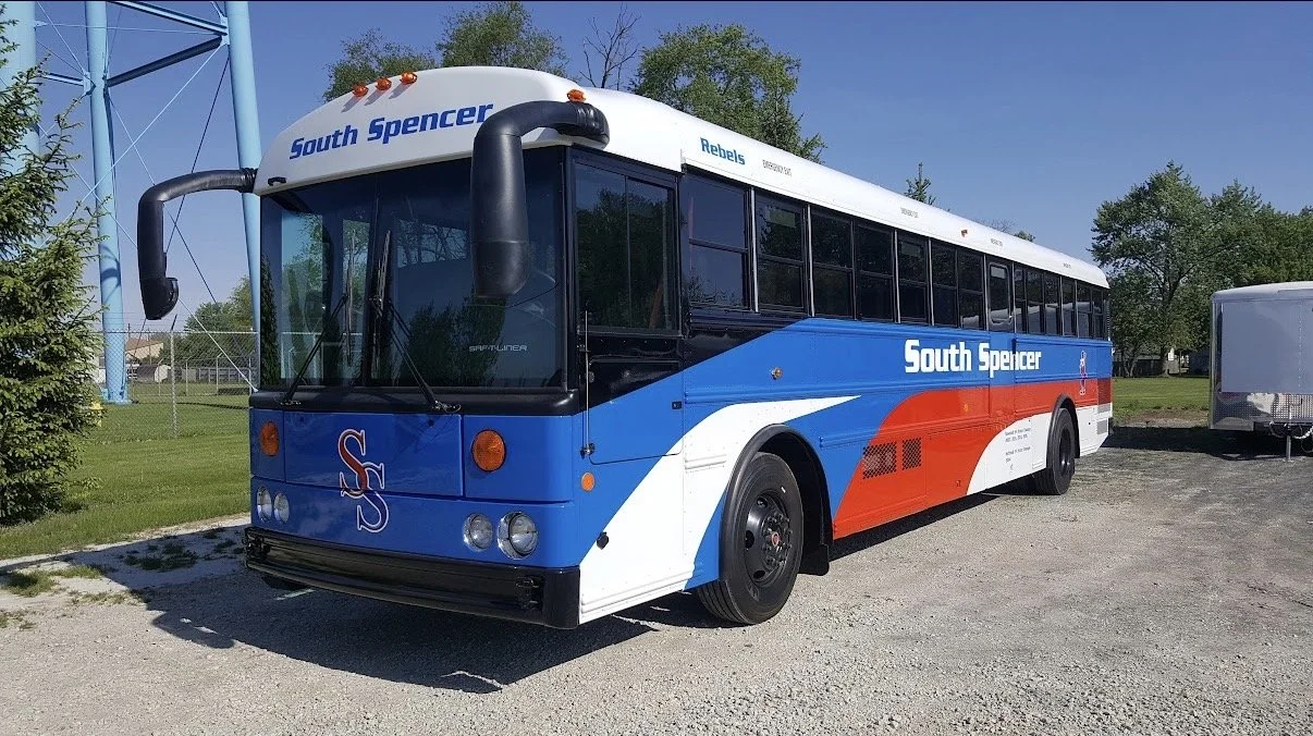 Full fleet vehicle refinishing by MB Industries in Akron, IN. Surface preparation, collision repair, and PPG Deltron/Delfleet coatings applied in large industrial booths to restore school buses, heavy-duty trucks, and specialty fleet equipment.